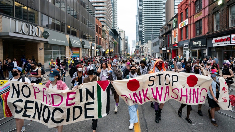 Pro Palestinian protesters disrupt the Toronto Pride Parade, on Sunday, June 30, 2024. THE CANADIAN PRESS/Arlyn McAdorey