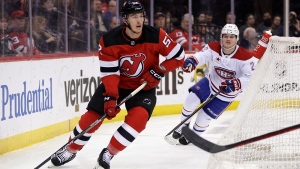 New Jersey Devils defenseman Cal Foote (52) skates with the puck against the Montreal Canadiens during the first period of an NHL hockey game Jan. 17, 2024, in Newark, N.J. (Source: AP Photo/Adam Hunger)