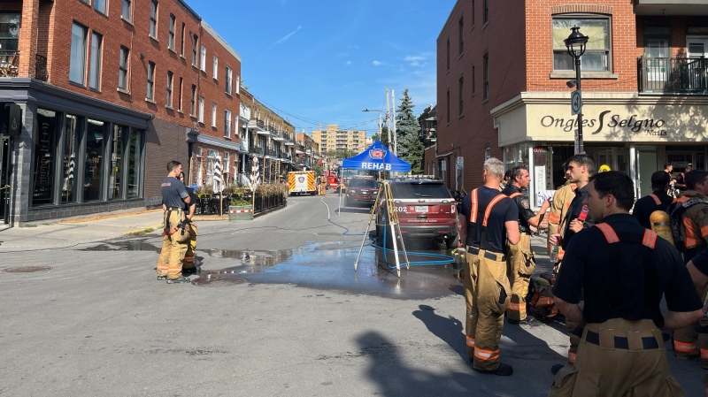 Montreal firefighters respond to a five-alarm fire in Verdun on Thursday, July 4, 2024. (Ken Dow/CTV News)