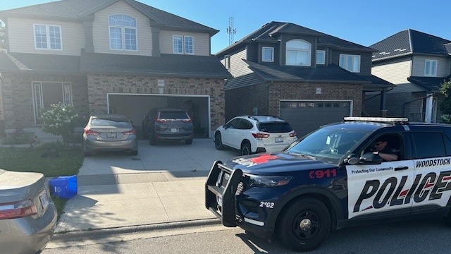 Woodstock police are parked outside of a home in the area of Champlain Avenue between Athlone Avenue and Frontenac Street. July 5, 2024. (Sean Irvine/CTV News London)