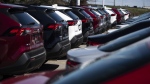 Auto retailers across North America continue to struggle with disruptions that started last week from cyberattacks on a software company used widely in the auto dealership sector. SUVs for sale are seen at an auto mall in Ottawa, April 26, 2021. THE CANADIAN PRESS/Justin Tang