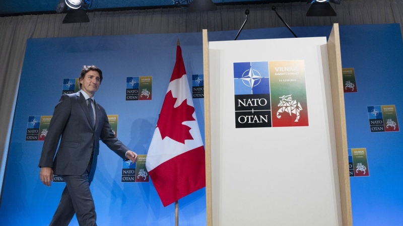 Prime Minister Justin Trudeau walks to the podium for his a closing news conference following the NATO Summit in Vilnius, Lithuania on July 12, 2023. THE CANADIAN PRESS/Adrian Wyld