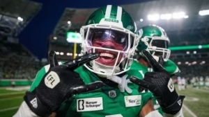 Saskatchewan Roughriders' Marcus Sayles (8) celebrates after running back an interception for a touchdown against the Toronto Argonauts during the second half of CFL football action in Regina, on Thursday, July 4, 2024. THE CANADIAN PRESS/Heywood Yu