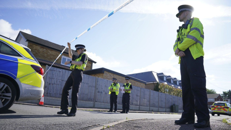 Police officers at the scene in Ashlyn Close where three women were killed in a crossbow attack at their home, on Tuesday, in Bushey, England, Thursday, July 11, 2024. (Jonathan Brady/PA via AP)