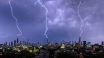This still from a video shows lightning hitting Chicago skyscrapers on Sunday, July 14, 2024.  (Source: Craig Shimala via Storyful)