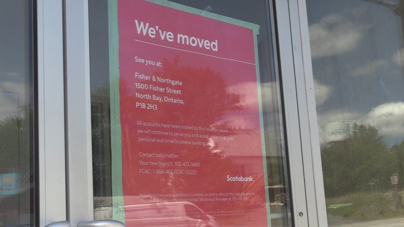 Sign at Scotiabank in Temagami notifying customers the bank moved to North Bay more than an hour's drive away. July 18, 2024 (John Shmyko/Municipality of Temagami)