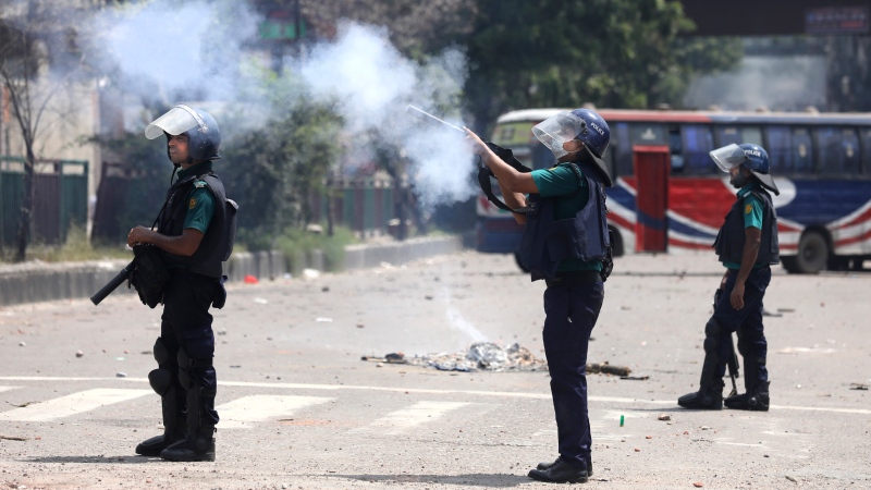 Policemen fire tear gas to disperse students protesting against the quota system in public service in Dhaka, Bangladesh, Thursday, July 18, 2024. (Rajib Dhar / AP Photo)