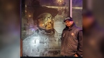 Anti-gun advocate and community leader Louis March stands next to an image of himself that was featured in the Nuit Blanche 2019 installation, ReConnectedSTC. (Supplied)