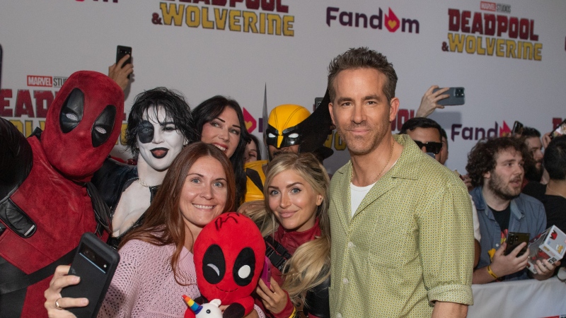 Ryan Reynolds poses with fans on the red carpet for the Canadian premiere of "Deadpool & Wolverine" in Toronto in this Tuesday, July 23, 2024 handout photo. THE CANADIAN PRESS/HO-Disney/George Pimentel