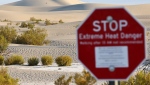 An 'Extreme Heat Danger' sign stands at Mesquite Flat Sand Dunes during a long-duration heat wave in Death Valley National Park on July 9, 2024. (Mario Tama / Getty Images via CNN Newsource)