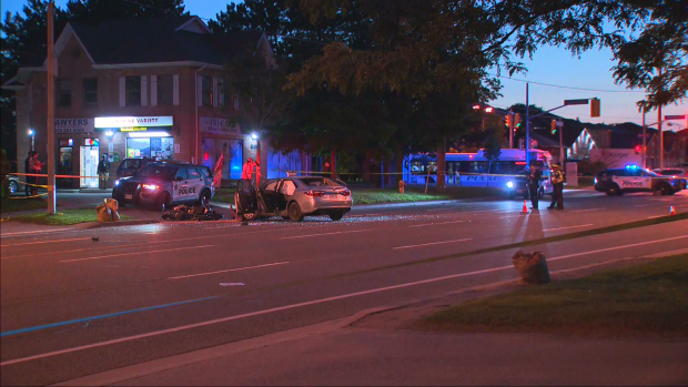 Police are on the scene of a fatal collision between a motorcycle and a car in Scarborough on Thursday, July 25, 2024. (CTV News Toronto)