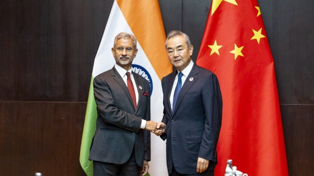 This photo obtained from the Indian Foreign Minister Subrahmanyam Jaishankar's X account shows Jaishankar, left, with his Chinese counterpart Wang Yi in Vientiane, Laos, Thursday, July 25, 2024. (X via AP)