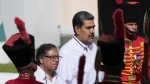 Venezuelan President Nicolas Maduro, right, stands with Colombian President Gustavo Petro after Petro arrived at Miraflores presidential palace in Caracas, Venezuela, Saturday, Nov. 18, 2023. (AP Photo/Ariana Cubillos, File)