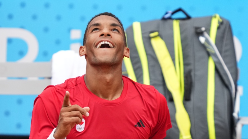 Felix Auger-Aliassime of Canada celebrates his win over Daniil Medvedev of AIN during third round in the men's singles at the 2024 Summer Olympics in Paris, France on Tuesday, July 30, 2024. (THE CANADIAN PRESS/Christinne Muschi)
