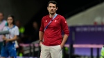 Canada's women's soccer coach Andy Spence watches a game against Colombia in Nice, France on July 31, 2024. (Julio Cortez / AP Photo)