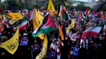 Iranian protesters wave Iranian, Palestinian and Lebanon's militant Hezbollah group flags in a demonstration to condemn the killing of Hamas leader Ismail Haniyeh, at Felestin (Palestine) Sq. in Tehran, Iran, July 31, 2024. (Vahid Salemi / AP Photo)