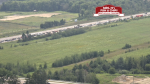 Cars stopped on Highway 400 for a police investigation. Aug. 1, 2024.