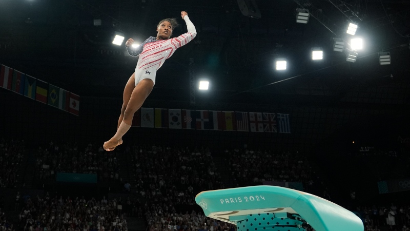 Simone Biles, of the United States, performs on the vault during the women's artistic gymnastics team finals round at Bercy Arena at the 2024 Summer Olympics, Tuesday, July 30, 2024, in Paris, France. (AP Photo/Charlie Riedel)