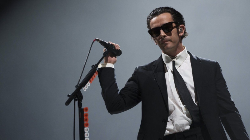 Matty Healy of the 1975 performs at the Reading Music Festival, England, on Aug. 28, 2022. (Scott Garfitt/Invision/AP)