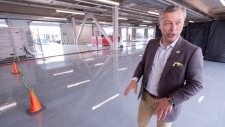 Francois Dumontier, president of Grand Prix de Formule 1 du Canada, stands in one of the new garages at the Circuit Gilles Villeneuve is seen in Montreal, Thursday, May 30, 2019. (Paul Chiasson/The Canadian Press)