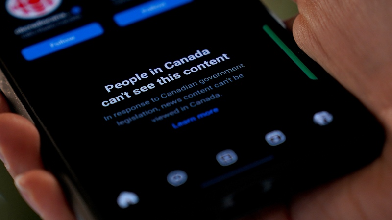 A smartphone showing Meta's blocking of Canadian news content on their Instagram social media app is shown in a photo illustration, in Toronto, Thursday, Aug. 1, 2024. THE CANADIAN PRESS/Giordano Ciampini 