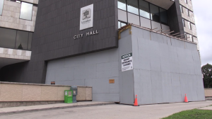 Plywood cladding blocks access to the front of London city hall while a soffit is replaced. (Daryl Newcombe/CTV News London)