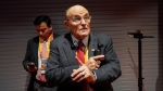 Former New York Mayor Rudy Giuliani talks to reporters before the Republican National Convention Tuesday, July 16, 2024, in Milwaukee. (AP Photo/Paul Sancya)