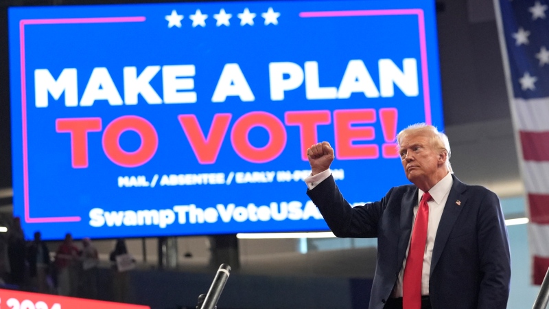 Republican presidential candidate former President Donald Trump gestures as he departs after speaking at a campaign rally at Georgia State University in Atlanta, Saturday, Aug. 3, 2024. (AP Photo/John Bazemore)