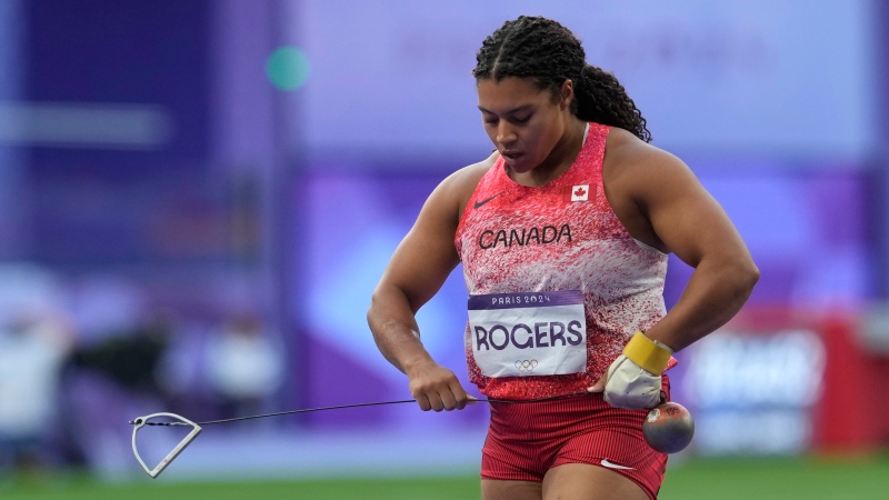 Canada's Camryn Rogers carries the hammer after her second throw in the women's hammer throw event at the Summer Olympics in Paris on Tuesday, Aug.6, 2024. (Adrian Wyld / The Canadian Press)