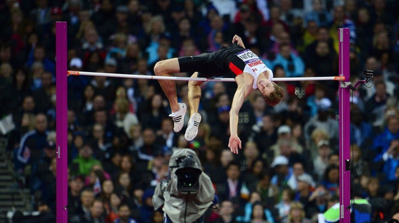 Drouin jumps to a bronze medal in the men's high jump final at the Olympic Stadium during the Summer Olympics in London on Tuesday, Aug. 7, 2012. THE CANADIAN PRESS/Sean Kilpatrick