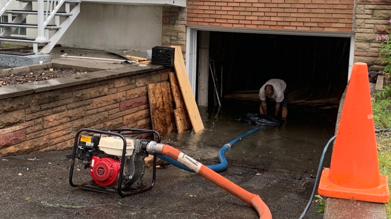 A garage was flooded in Montreal during heavy rains on Aug. 9, 2024. (Angela MacKenzie/CTV News)
