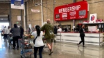 Customers walk by the membership counter at a Costco store on July 11, 2024 in Richmond, Calif. (Justin Sullivan/Getty Images via CNN Newsource)