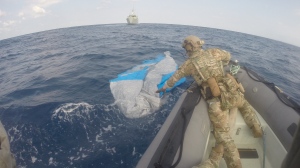 Sailors on Operation Caribbe seize suspected contraband while HMCS Edmonton searches a field of jettisoned cargo in the eastern Pacific Ocean on April 8, 2023. (Canadian Armed Forces)