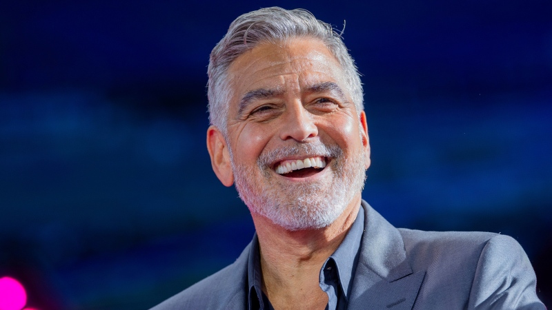 George Clooney, U.S. actor, smiles at the Digital X digital congress at the Media Park in Cologne, Germany, Wednesday, Sept. 20, 2023. (Rolf Vennenbernd / dpa via AP)