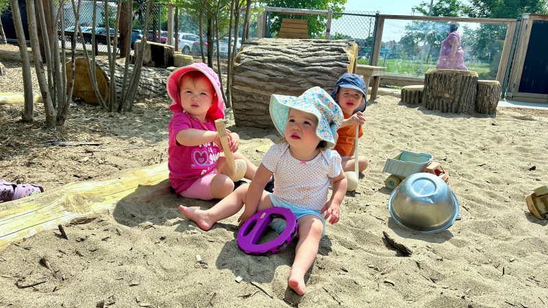 Toddlers play in the sand at a RisingOaks centre in Kitchener, Ont. (Heather Senoran/CTV News)