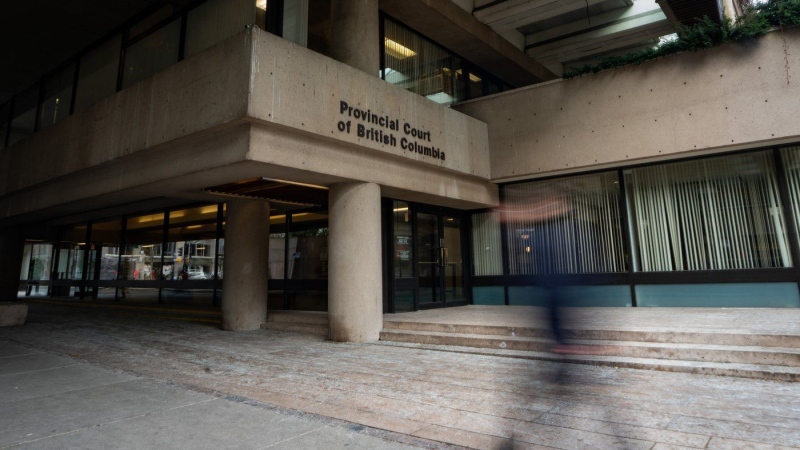 A person walks past the provincial court in Vancouver, B.C., Jan. 16, 2024. (THE CANADIAN PRESS/Ethan Cairns)