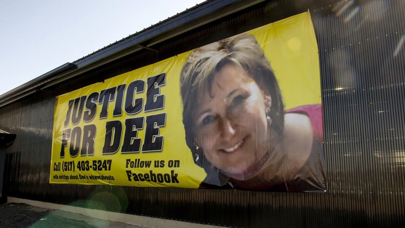 A banner shows a photo of missing woman Dee Warner in Tipton, Mich. on May 9 2022. (Jacob Hamilton/Jackson Citizen Patriot via AP)