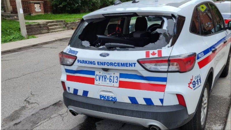 Toronto police are searching for a man who allegedly broke a parking enforcement cruiser's window and stole items from inside. (Toronto Police Association/X)