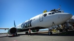 Flair Airlines Captain Ken Symonds inspects the outside of one of the company's aircraft at Vancouver International Airport, in Richmond, B.C., Wednesday, April 17, 2024. THE CANADIAN PRESS/Darryl Dyck