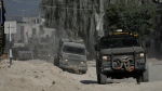 An Israeli tank manoeuvres near the Israel-Gaza border, southern Israel, Thursday, Aug. 29, 2024. (AP Photo/Tsafrir Abayov)