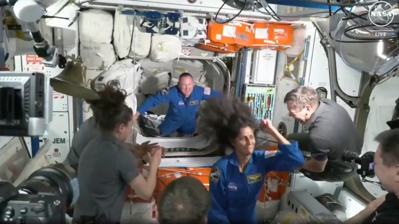 NASA astronauts Butch Wilmore and Suni Williams are welcomed by the International Space Station crew on June 6, 2024. (NASA via AP)