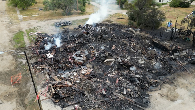 Some hot spots still remained in the rubble of the Sask. Village of Wiseton's old hotel and town office the day after a fire, Sept. 4, 2024. (Chad Hills / CTV News)