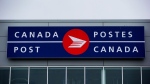 The Canada Post logo is seen on the outside the company's Pacific Processing Centre, in Richmond, B.C., June 1, 2017. THE CANADIAN PRESS/Darryl Dyck