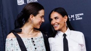 Margaret Qualley and Demi Moore arrive on the red carpet for the premiere of 'The Substance' at the Royal Alexandra Theatre, during the Toronto International Film Festival, in Toronto on Sept. 5, 2024 (THE CANADIAN PRESS/Cole Burston)