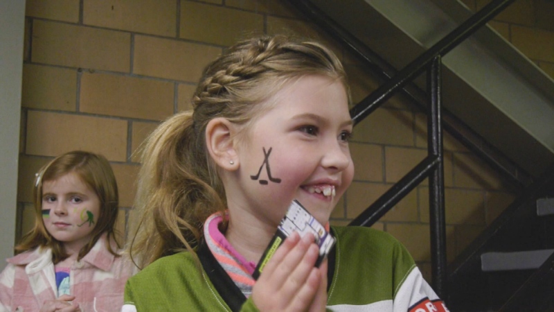 Two young female fans celebrating the Troops at North Bay Battalion's Fan Fest at Memorial Gardens on September 8, 2024. (Eric Taschner/CTV News Northern Ontario)