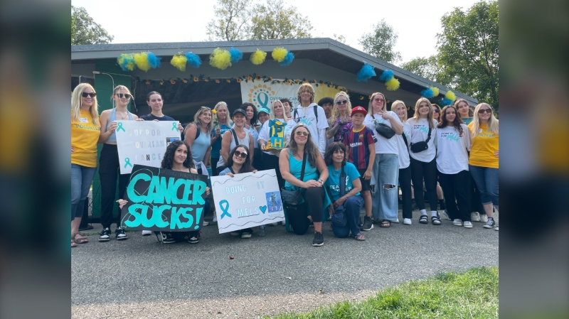 A group of participants stand together for a photo in Kildonan Park after the 21st annual Walk of Hope for ovarian cancer on Sept. 8, 2024. (Alexandra Holyk/CTV News Winnipeg)