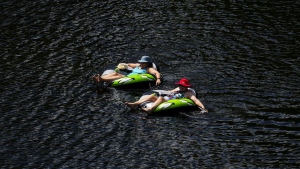 People float in the Madawaska River in Renfrew County, Ont., on July 8, 2024. THE CANADIAN PRESS/Sean Kilpatrick