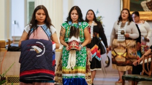 Belongings of Grand Chief Cathy Merrick are carried into a ceremony at the Legislature in Winnipeg on Wednesday, September 11, 2024. (John Woods/The Canadian Press)