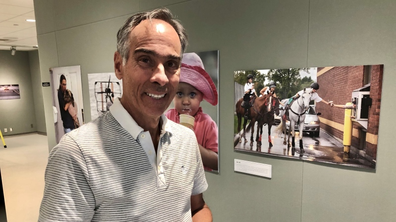 Nick Brancaccio with his photos at Chimczuk Museum in Windsor, Ont. on Sept. 11, 2024. (Gary Archibald/CTV News Windsor)