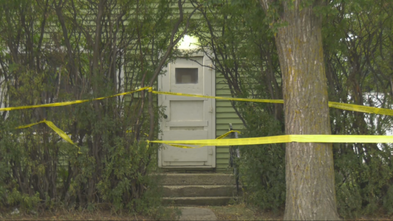 Police tape surrounds a house at 50 Street and 47 Avenue in Lloydminster on Sept. 12, 2024, the day after police warned the public they were responding to an "unfolding incident" in the area. (Evan Klippenstein / CTV News Edmonton) 